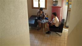 Will and Lawrence complete their game of chess as we prepare to leave Château d'Oex Youth Hostel
